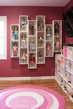 a living room filled with lots of dolls on shelves next to a pink rug and window