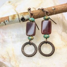 Brown Boho Dangle Earrings crafted with care, a must-have for fall.  Made with high-quality bronze finish, these earrings exude elegance and sophistication.  Adorned with captivating Czech glass beads, they add a touch of vibrancy and uniqueness to your outfit. Artisan glass beads produced in small quantities in the Czech Republic Hypoallergenic ear wires (nickel and lead free). Select ear wire style at checkout. A gift for you or someone special, earrings are carded and in an organza bag. Link Special Earrings, Copper Accents, Earring Crafts, Copper Finish, Hand Made Jewelry, Glass Earrings, Czech Glass Beads, Antique Copper, Ear Wire