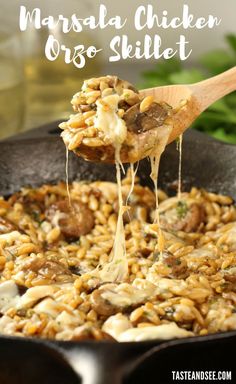 a skillet filled with mushroom and rice covered in gravy