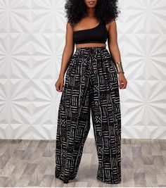 These wide leg pants are a must-have as they are designed to accentuate your gorgeous figure and show off your beautiful ankles. It is very comfortable elastic waist and so beautiful to pair with a variety of pieces in your wardrobe. Can be combined with the matching headband. * Wide Ankara pants with side pockets. * The pants have an elastic waistband * Designed to fit and flatter different body types. * This item is handmade with very high quality 100% cotton African wax print *This item is re High Waist Pallazo Pants, Luxury Black Palazzo Set For Women, Wide Pants With Hlazee, Wide Leg Pants Boohoo, Luxury Women's Pants For Navratri, Harem Pants African Print, Luxury Floor-length Bohemian Palazzo Set, Pallazo Outfit Palazzo Casual, Pallazo Trouser Styles