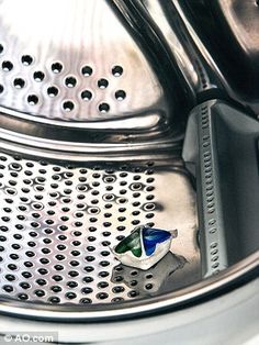 a close up of a washing machine with the words use a dishwasher tablet