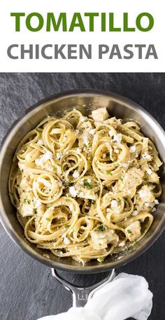 a pan filled with pasta and sauce on top of a table