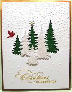 a christmas card with two trees and a bird on the top one is white, green and gold