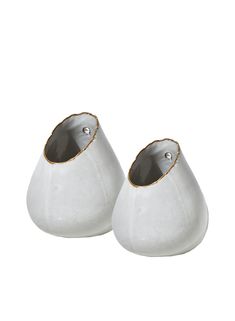 pair of white ceramic vases with gold trim