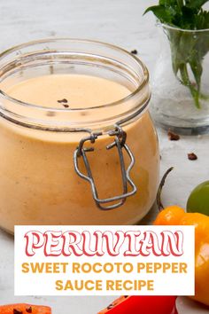 a glass jar filled with sweet potato pepper sauce next to sliced peppers and bell peppers