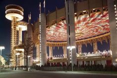 an amusement park lit up at night with lights