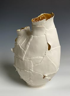 a white vase that has been torn open