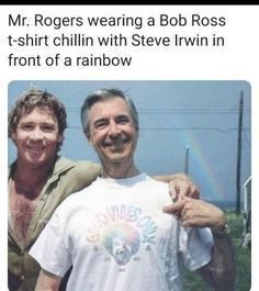 two men standing next to each other in front of a house with a rainbow behind them