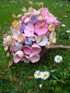 a bouquet of flowers sitting in the grass