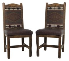 a pair of wooden chairs with leather upholstered seats