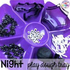 a purple tray filled with lots of beads and other things to make it look like a play dough tray