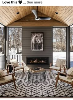 a living room with two chairs and a fire place in the center, surrounded by wood paneling