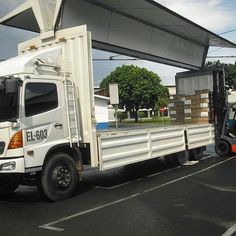 two trucks are parked next to each other