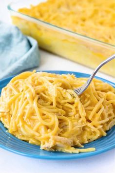 a blue plate topped with macaroni and cheese