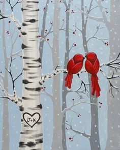 two red birds perched on the branches of a birch tree