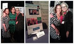 two women hugging each other in front of a poster at an event and another woman standing next to her