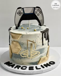 a birthday cake with a video game controller on top