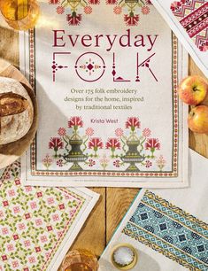 the cover of everyday folk book on a table with apples and other items around it