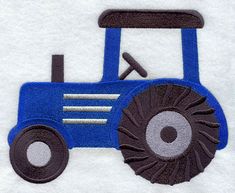 a blue tractor embroidered onto a white towel