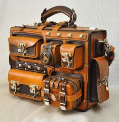 three pieces of brown leather luggage stacked on top of each other with handles and zippers