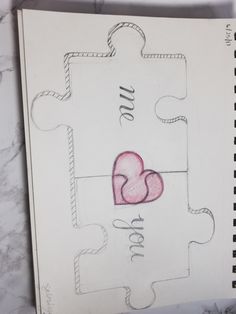 a piece of puzzle with two hearts on it