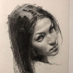 a pencil drawing of a woman's face with her head tilted to the side