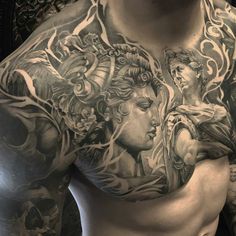 a man with many tattoos on his chest