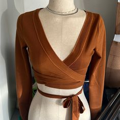 V Neck Wrap Crop Top. *Runs Small Size Up Cheap Bohemian V-neck Crop Top, Fitted Brown Wrap Top, Brown Cotton V-neck Blouse, Fitted Brown V-neck Blouse, Brown V-neck Crop Top, Half Zip Shirt, Pretty Dresses Casual, Lacey Tops, Cropped Long Sleeve Top