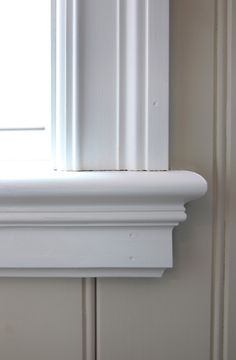 the corner of a window with white trim