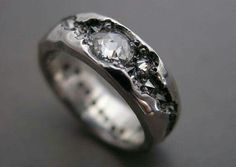 a white gold ring with diamonds on it