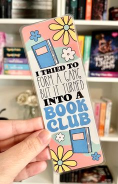 someone is holding up a book club case