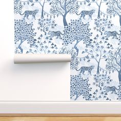 a wallpaper with blue trees and animals on it