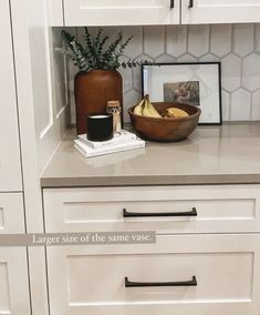 a bowl of bananas sitting on top of a counter