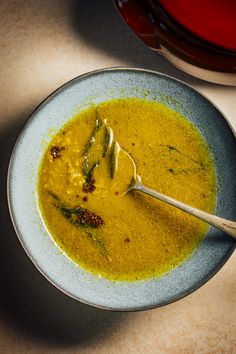 a bowl of soup with a spoon in it