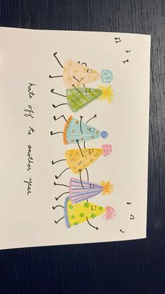 a card with some drawings on it and the words happy birthday written in different languages