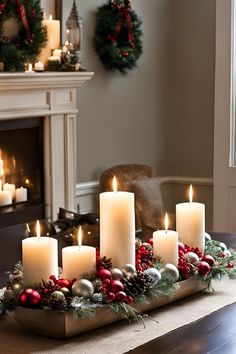 candles are lit on a tray with christmas decorations