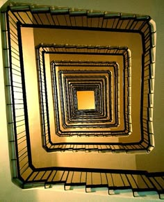 an image of a spiral staircase going into the light