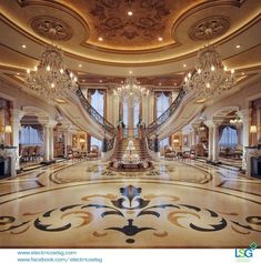 an elaborately decorated lobby with chandeliers and marble floors, is pictured in this image