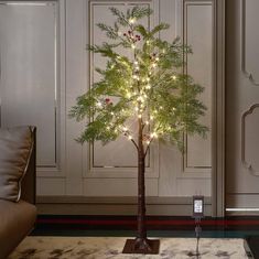 a lighted christmas tree in a living room