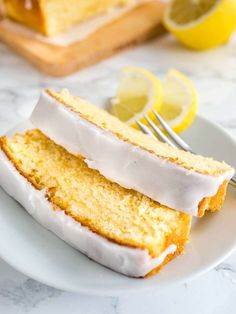 a slice of lemon cake on a plate with a fork