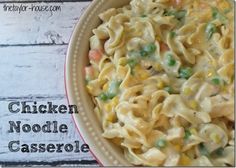 chicken noodle casserole in a bowl on a white wooden table with text overlay