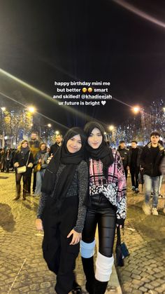 two women standing next to each other on a cobblestone street at night with the caption happy birthday, mimie best friend