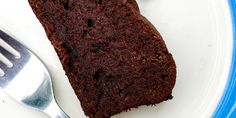 a piece of chocolate cake on a plate with a fork