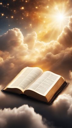 an open book sitting on top of a cloud filled sky with the sun behind it