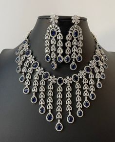 From classic solitaires to intricate patterns,
 discover the perfect blend of sophistication and glamour. Silver Necklaces Indian, Ceremony Outfit, American Diamond Necklace Set, Cz Stone Necklace, Silver Bridal Jewellery, Indian Diamond Jewellery, Real Diamond Necklace, Silver Diamond Jewelry