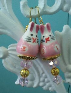 Pink Bunny earrings about 1- 3/4 inches long with fish hook ear wires. And gold like findings and Bunny beads. Also for your earrings I have included earring stoppers to keep your earring on. Perfect for ladies and girls  I make hat pins and lapel pin with these Bunny too. If you want to buy a lapel pin or hat pin to match for a set please conversation me and I will tell you the price and make a special order  for you thanks for looking Bunny Ceramic, Easter Bunny Earrings, Easter Jewelry, Beaded Hat, Bunny Earrings, Pink Pumpkins, Pink Bunny, Beaded Jewelry Patterns, Beaded Dangle Earrings