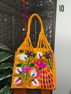 "Artisanal Handwoven Mexican Floral Tote Bag, great for your Beach or Boho look. Eco-friendly, super handy for groceries or to carry your books. Overview *Thread material *approximate measurements: 15\" tall x 16\" wide Care *hand wipe only *delicate care Please email me your questions before buying. All of my items come from a smoke and pet free environment. I WILL BE PROCESS YOUR ORDER IN 1-2 DAYS. If you need the item expressed shipped please contact me to request it and the listing will be a Embroidered Natural Tote Shoulder Bag, Natural Embroidered Tote Bag, Rectangular Woven Canvas Bag For Daily Use, Natural Color Embroidered Tote Bag, Yellow Woven Shoulder Bag For Shopping, Yellow Bohemian Rectangular Bag, Bohemian Yellow Square Bag, Yellow Rectangular Bohemian Bag, Yellow Square Bohemian Bag