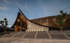 an architecturally designed building with stairs leading up to it