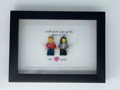 two legos are in a shadow frame with the words i will never ever end of you