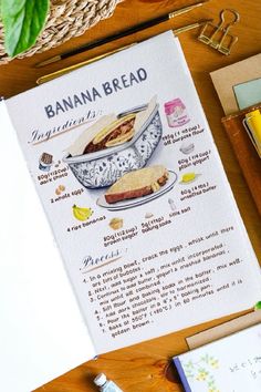 a banana bread recipe sitting on top of a table next to some pens and pencils